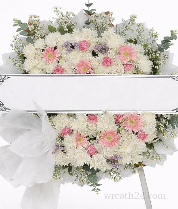 พวงหรีดยโสธรชมพูอ่อนผสมขาว นุ่มนวล เหมาะคนใกล้ชิด